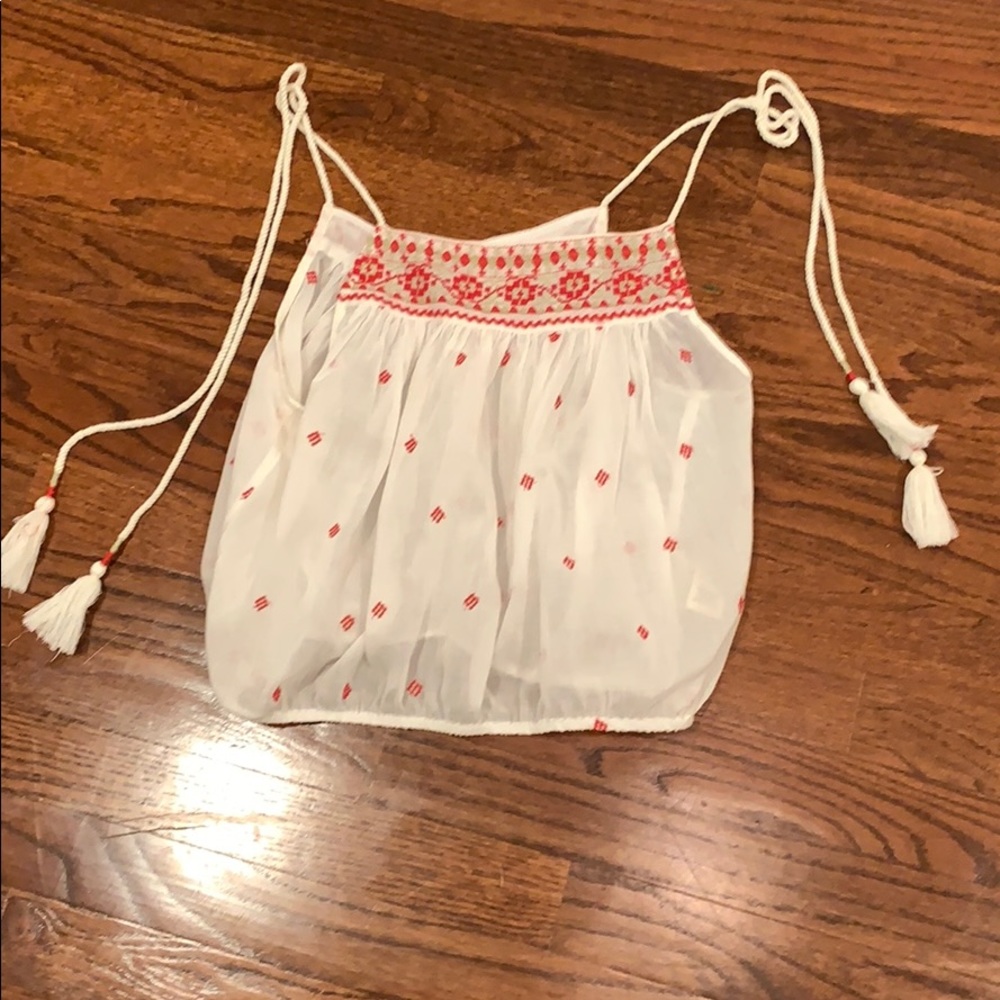 White flowy stop with red designs